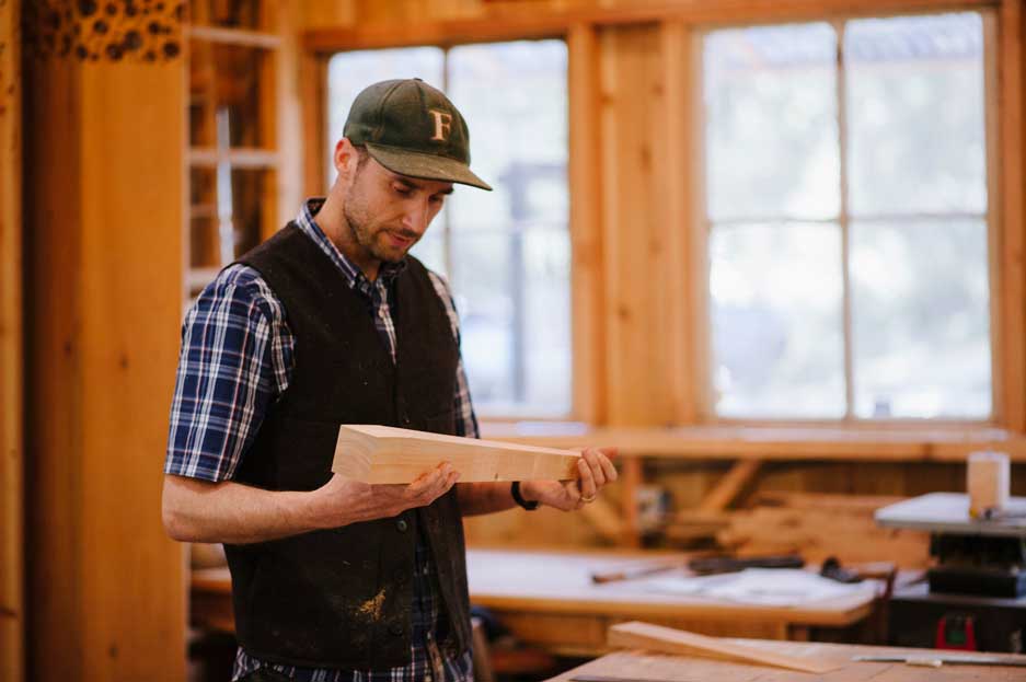 Cody making a leg for a custom table in the shop at Wayland Constructive