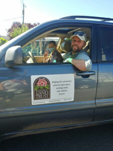 Two people smiling in car
